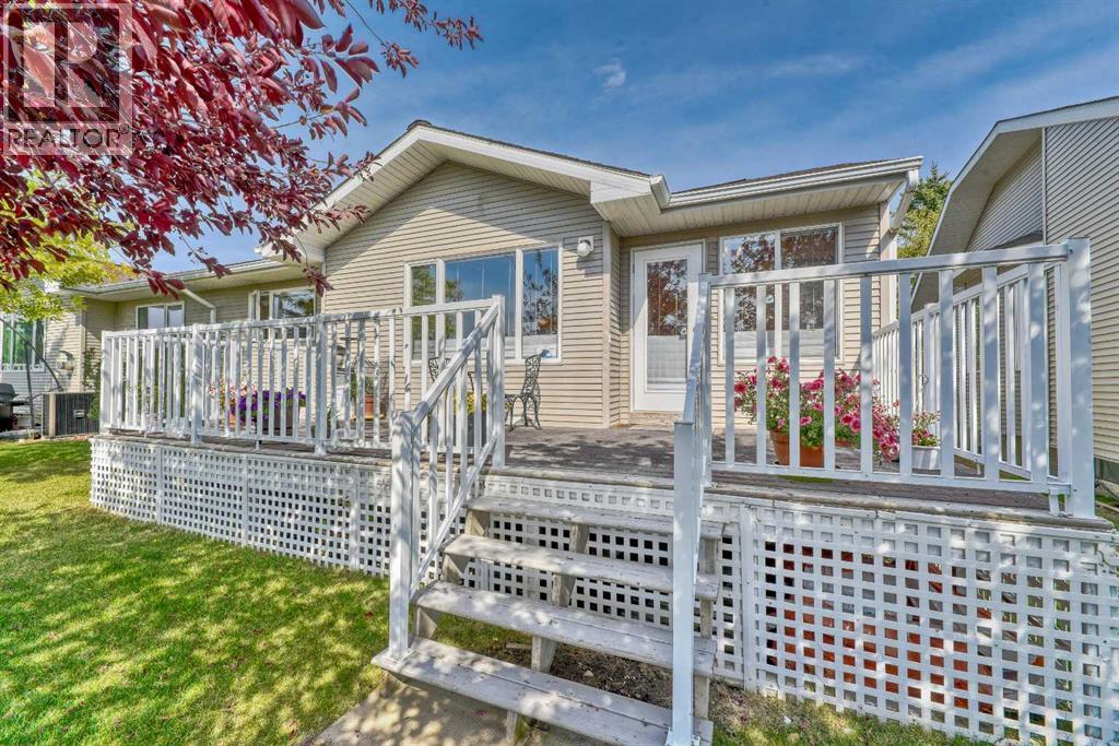 7 Scotia Landing Nw, Calgary, AB - Outdoor With Deck Patio Veranda