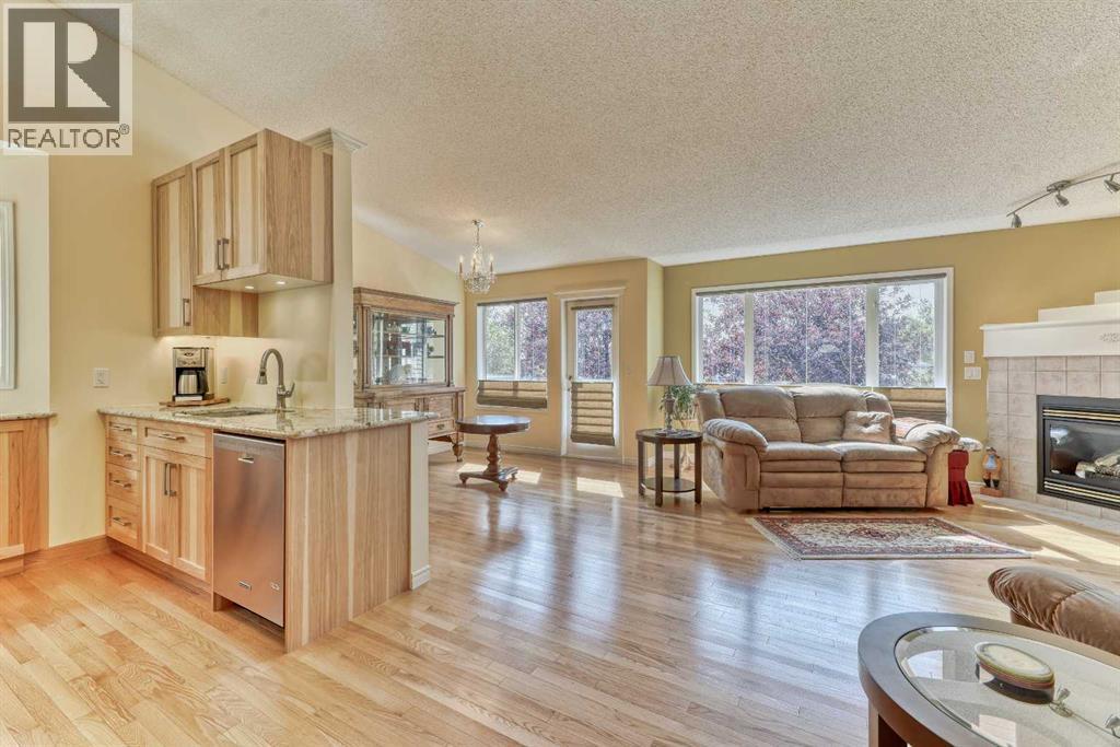 7 Scotia Landing Nw, Calgary, AB - Indoor Photo Showing Living Room With Fireplace