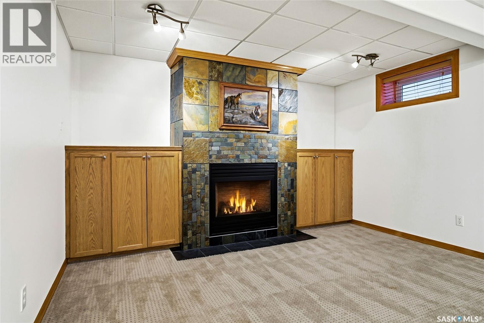 2906 St James Crescent, Regina, SK - Indoor Photo Showing Other Room With Fireplace