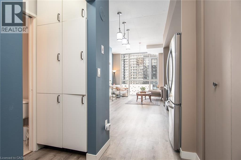 Pantry storage and front hall closet. - 191 King Street S Unit# 702, Waterloo, ON - Indoor Photo Showing Other Room