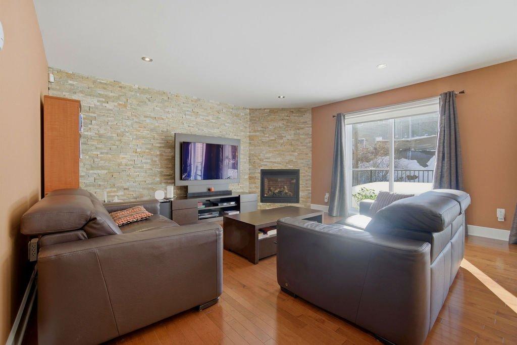 Living room - 1447 Boul. Maisonneuve, Saint-Jérôme, QC - Indoor Photo Showing Living Room With Fireplace