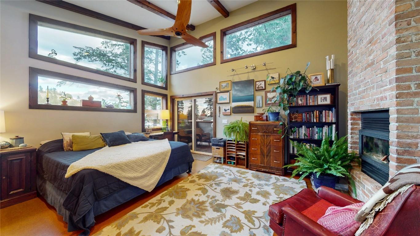 166 304Th Avenue, Kimberley, BC - Indoor Photo Showing Bedroom With Fireplace