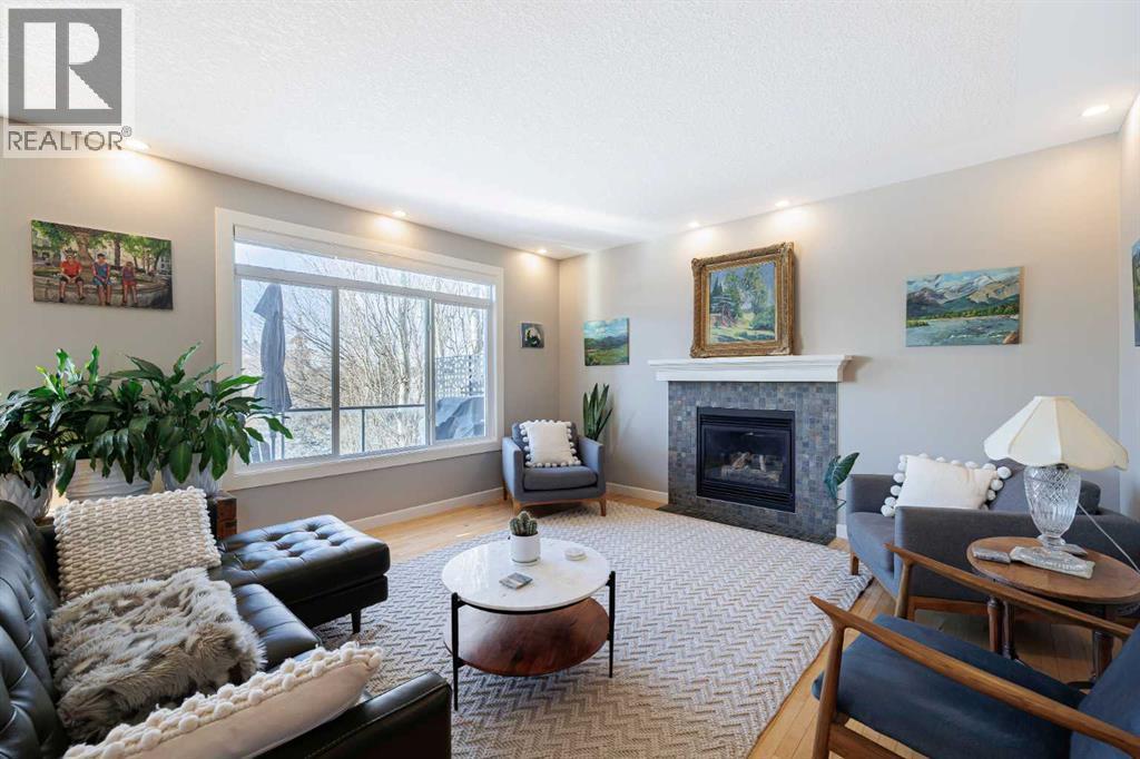 98 Tuscany Estates Crescent Nw, Calgary, AB - Indoor Photo Showing Living Room With Fireplace
