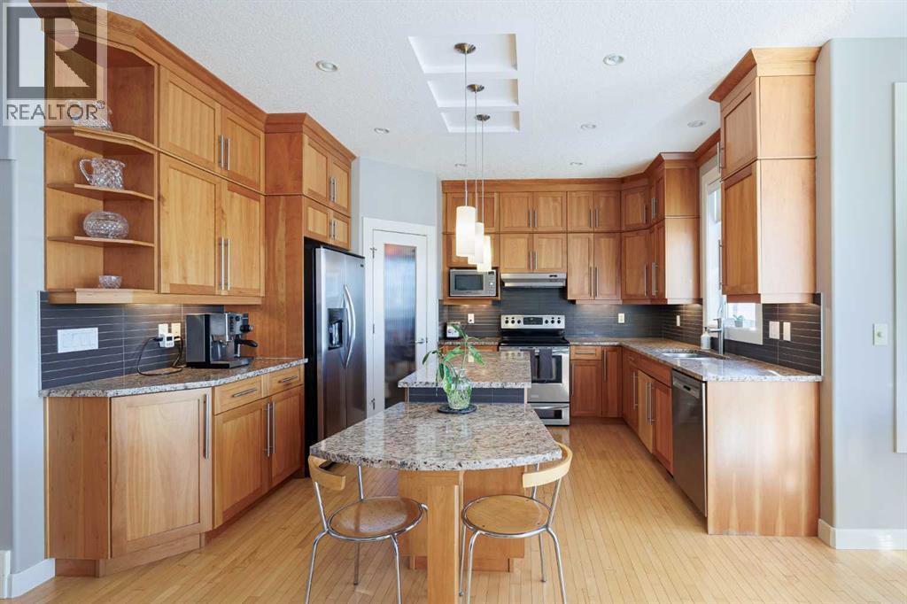 98 Tuscany Estates Crescent Nw, Calgary, AB - Indoor Photo Showing Kitchen With Stainless Steel Kitchen With Double Sink