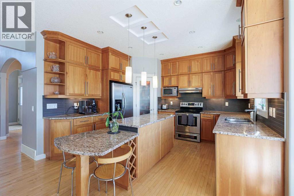 98 Tuscany Estates Crescent Nw, Calgary, AB - Indoor Photo Showing Kitchen With Stainless Steel Kitchen With Double Sink