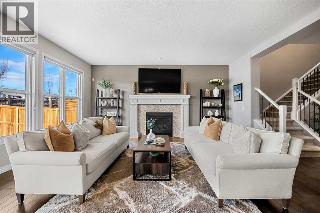 206 Mahogany Passage Se, Calgary, AB - Indoor Photo Showing Living Room With Fireplace