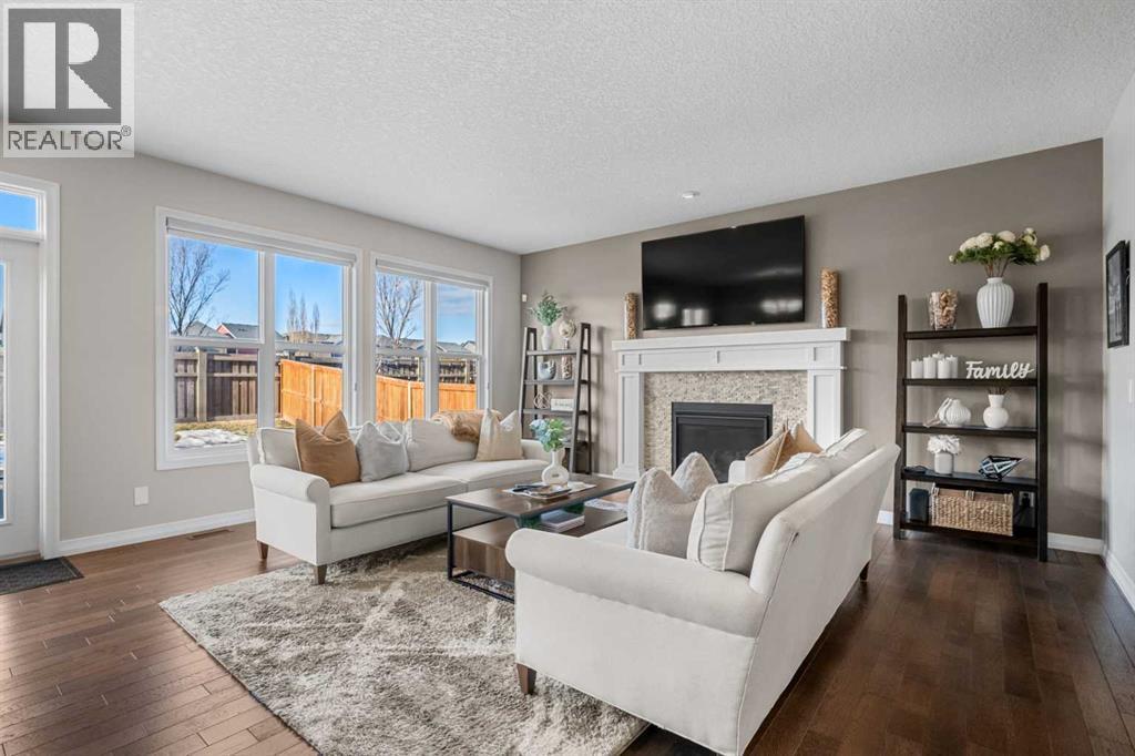 206 Mahogany Passage Se, Calgary, AB - Indoor Photo Showing Living Room With Fireplace