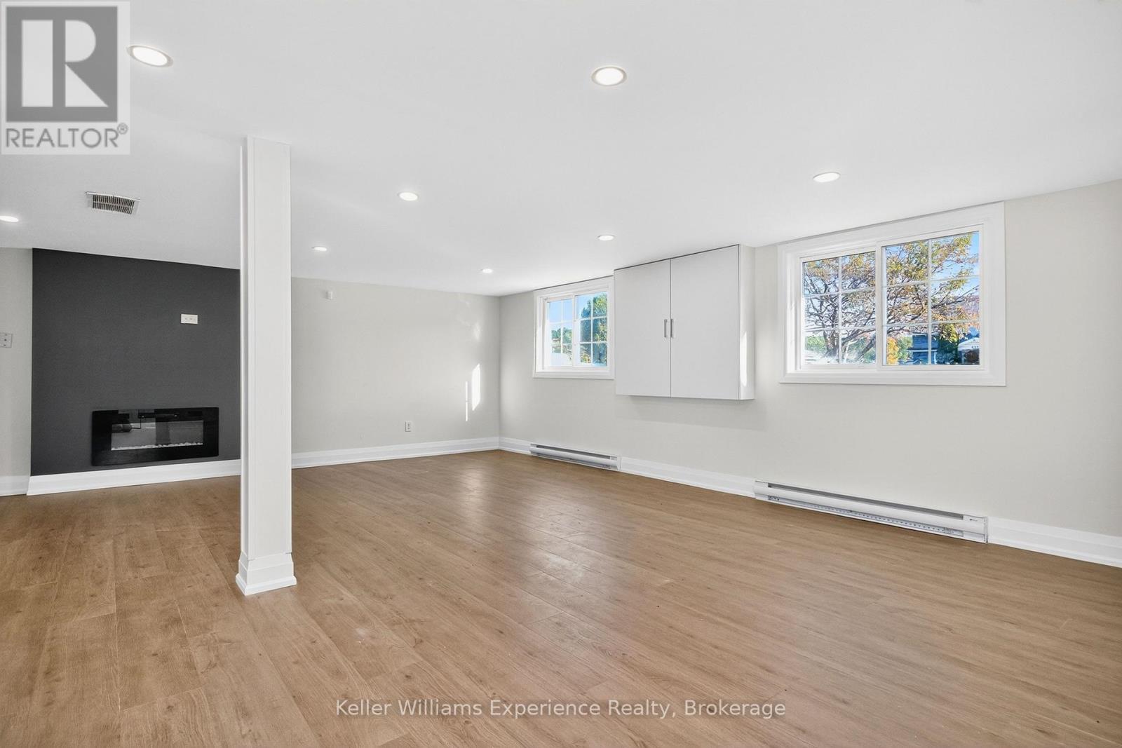 556 Champlain Road, Tiny, ON - Indoor Photo Showing Other Room With Fireplace