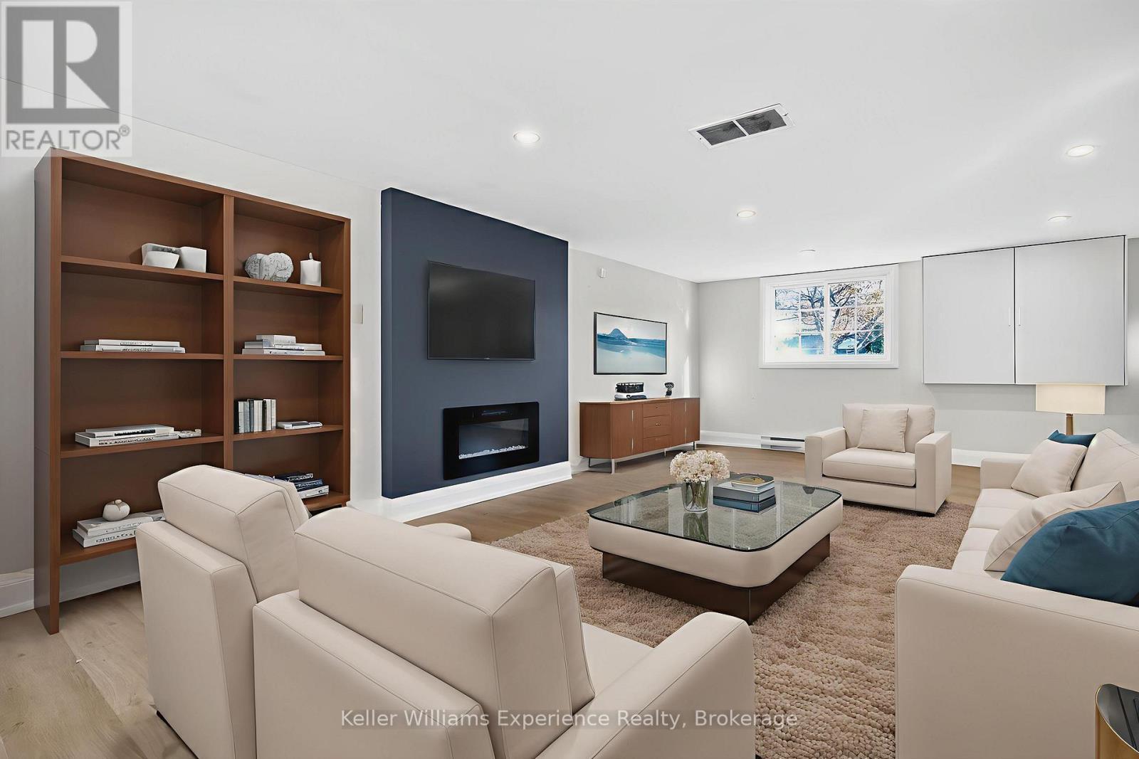 Digitally Staged - 556 Champlain Road, Tiny, ON - Indoor Photo Showing Living Room With Fireplace