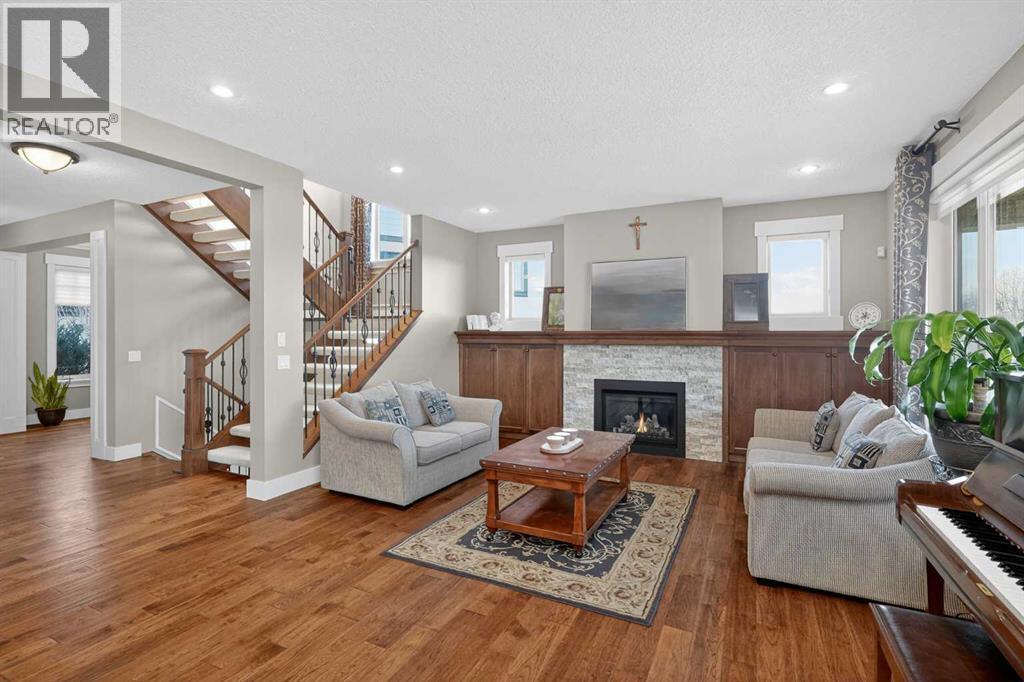72 Rockcliff Grove Nw, Calgary, AB - Indoor Photo Showing Living Room With Fireplace