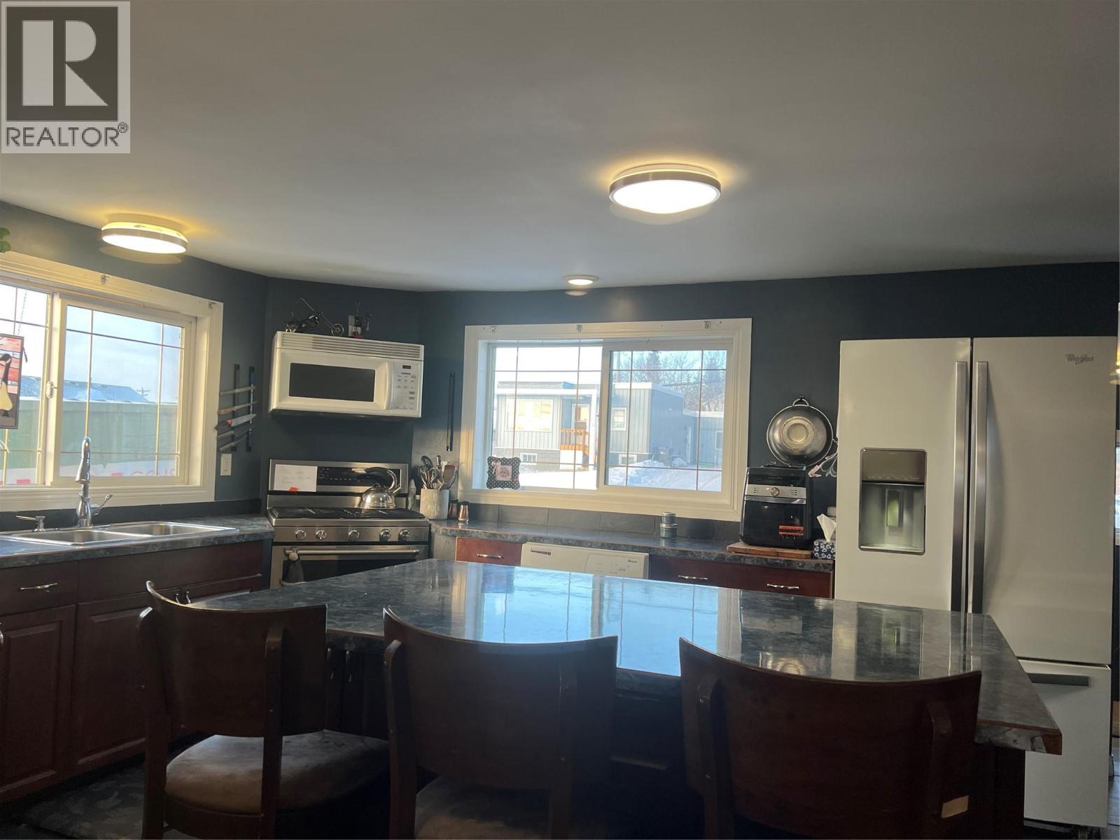 705 100A Avenue, Dawson Creek, BC - Indoor Photo Showing Kitchen With Double Sink