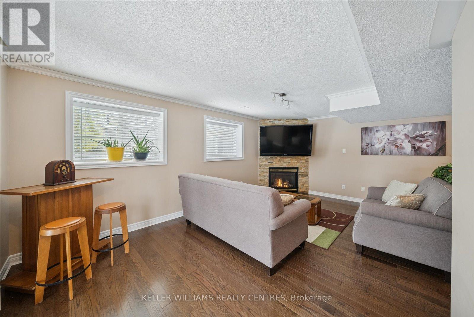 76 Kerfoot Street, Georgina, ON - Indoor Photo Showing Living Room With Fireplace
