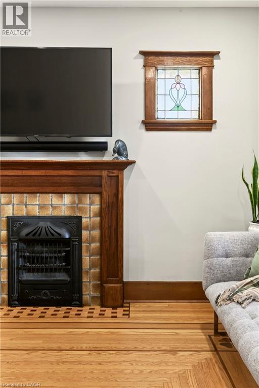 22 Mill Street, Hamilton, ON - Indoor Photo Showing Living Room With Fireplace