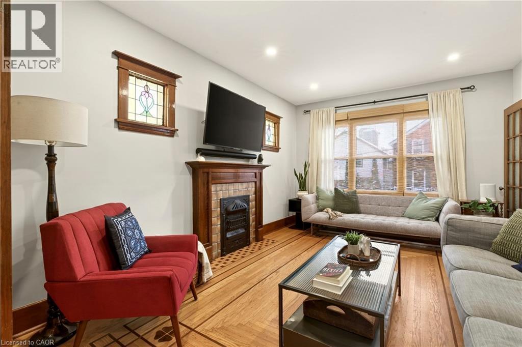 22 Mill Street, Hamilton, ON - Indoor Photo Showing Living Room With Fireplace