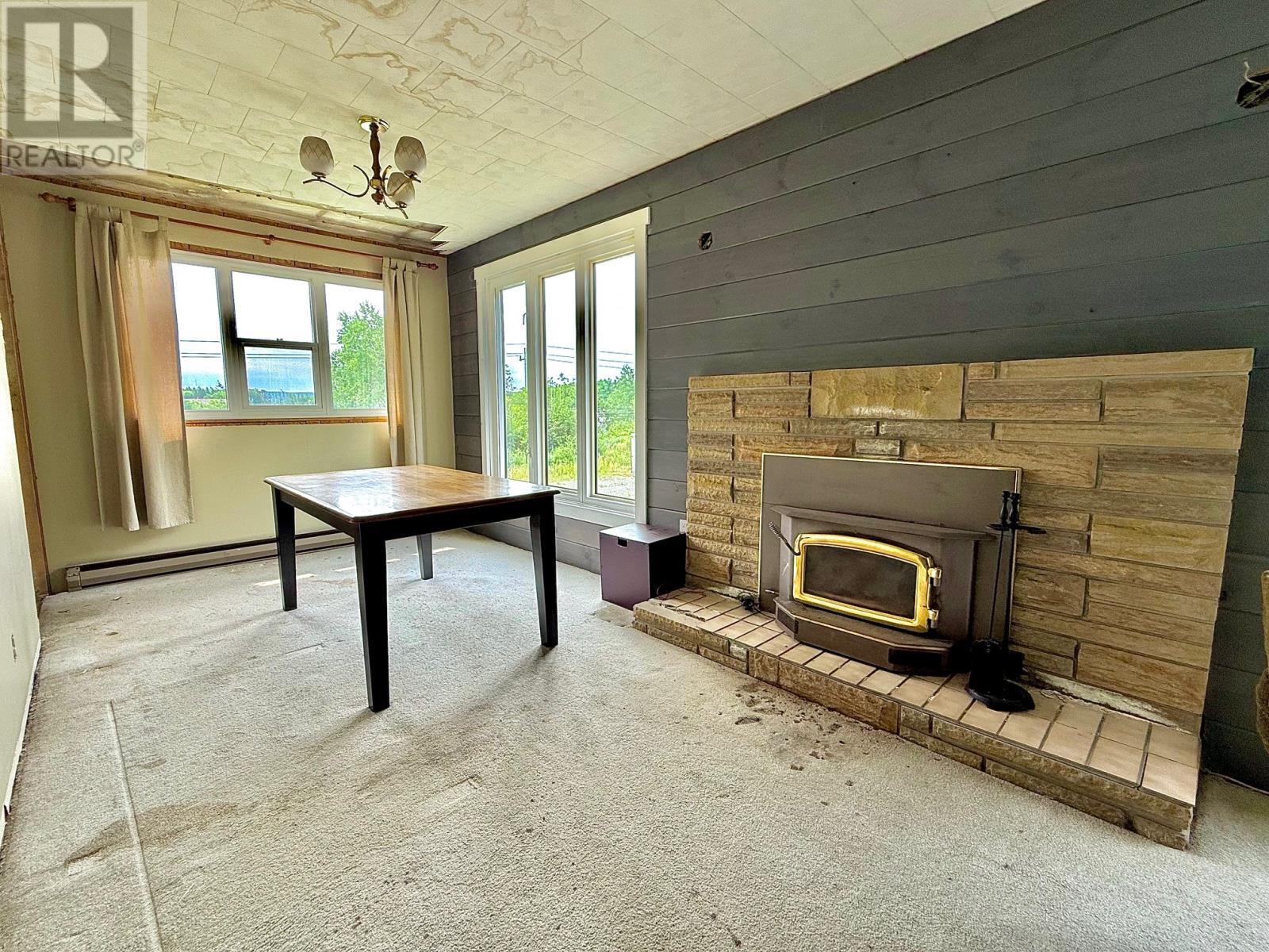 5 Old Mill Road, Clarenville, NL - Indoor Photo Showing Other Room With Fireplace
