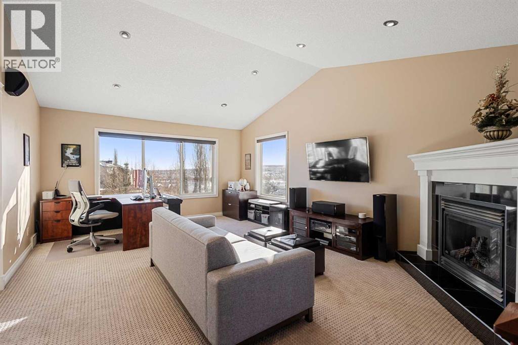 157 Hidden Creek Road Nw, Calgary, AB - Indoor Photo Showing Living Room With Fireplace