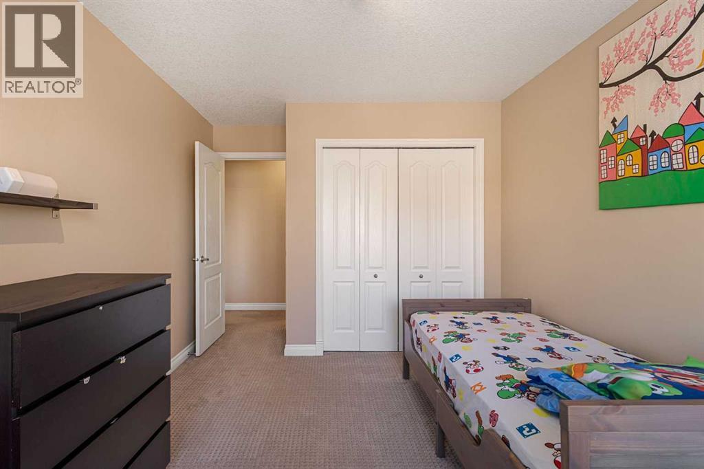 157 Hidden Creek Road Nw, Calgary, AB - Indoor Photo Showing Bedroom