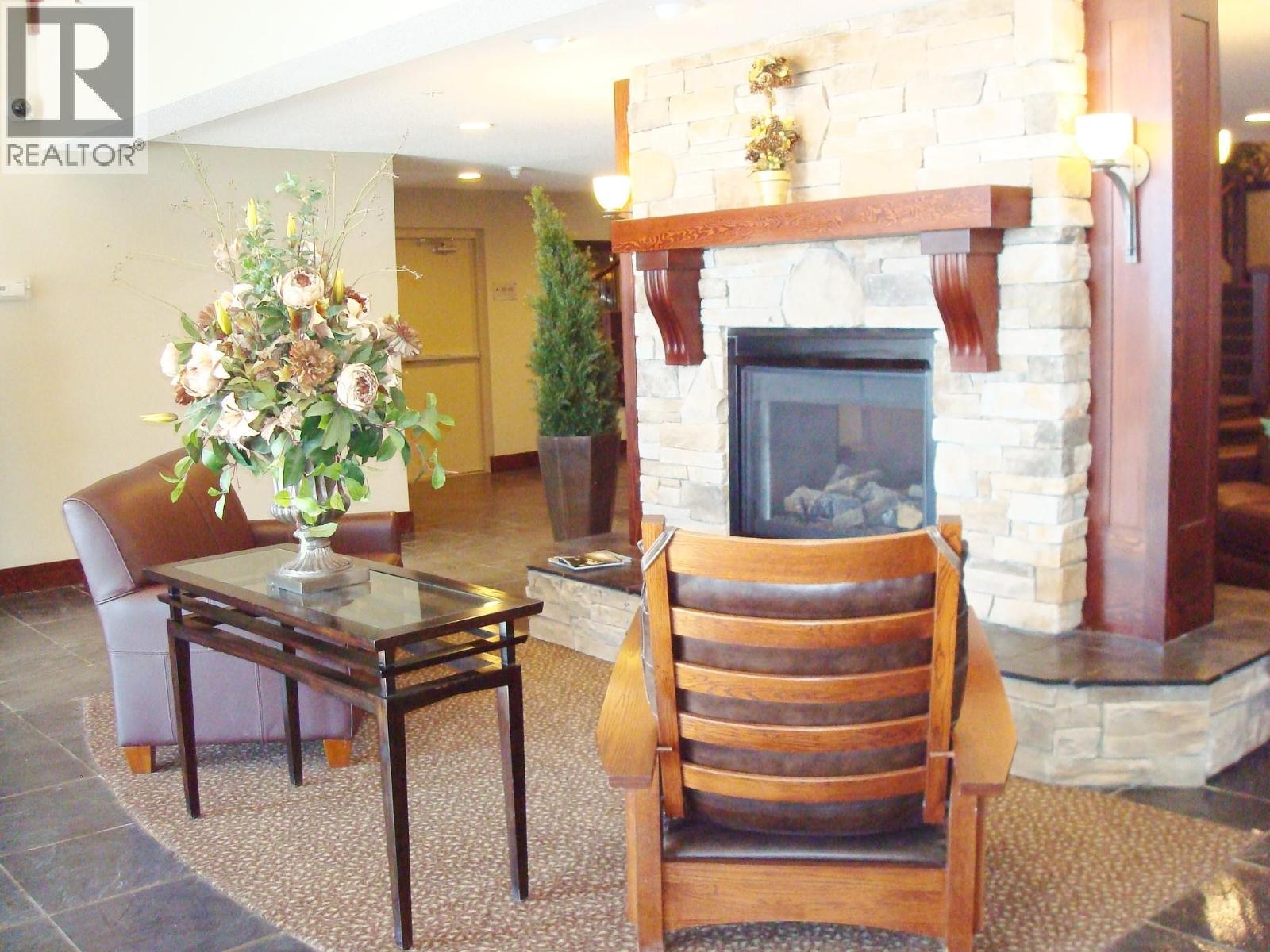 1500 Mcdonald Avenue Unit# 122, Fernie, BC - Indoor Photo Showing Living Room With Fireplace