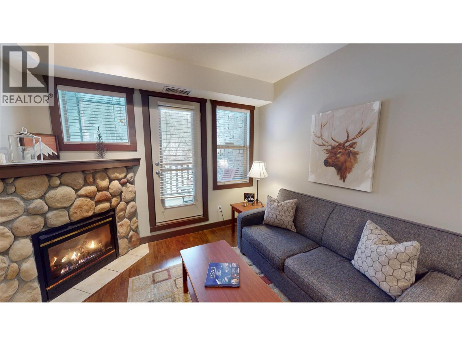 1500 Mcdonald Avenue Unit# 122, Fernie, BC - Indoor Photo Showing Living Room With Fireplace