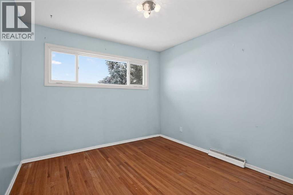 44 Winslow Crescent Sw, Calgary, AB - Indoor Photo Showing Other Room