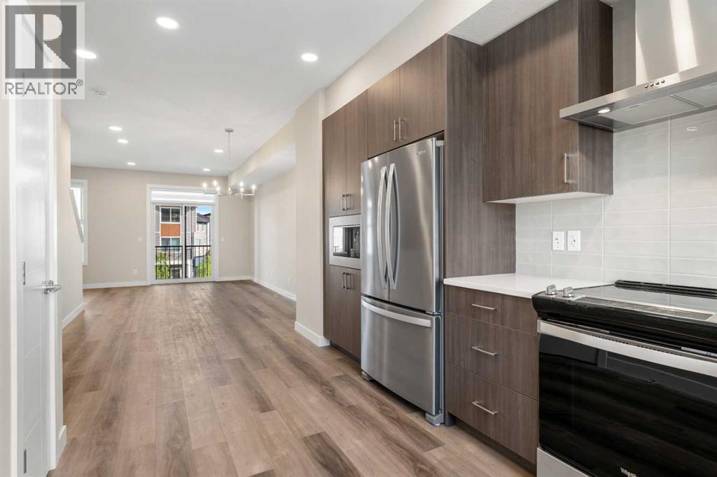 72, 285 Chelsea Court, Chestermere, AB - Indoor Photo Showing Kitchen With Stainless Steel Kitchen With Upgraded Kitchen