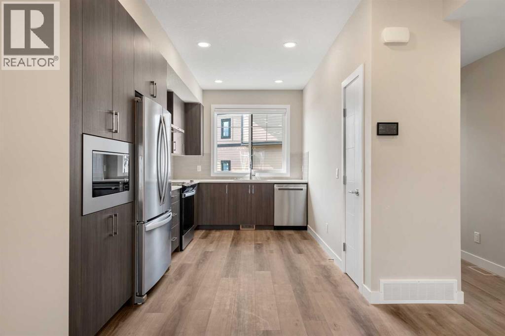 72, 285 Chelsea Court, Chestermere, AB - Indoor Photo Showing Kitchen With Stainless Steel Kitchen