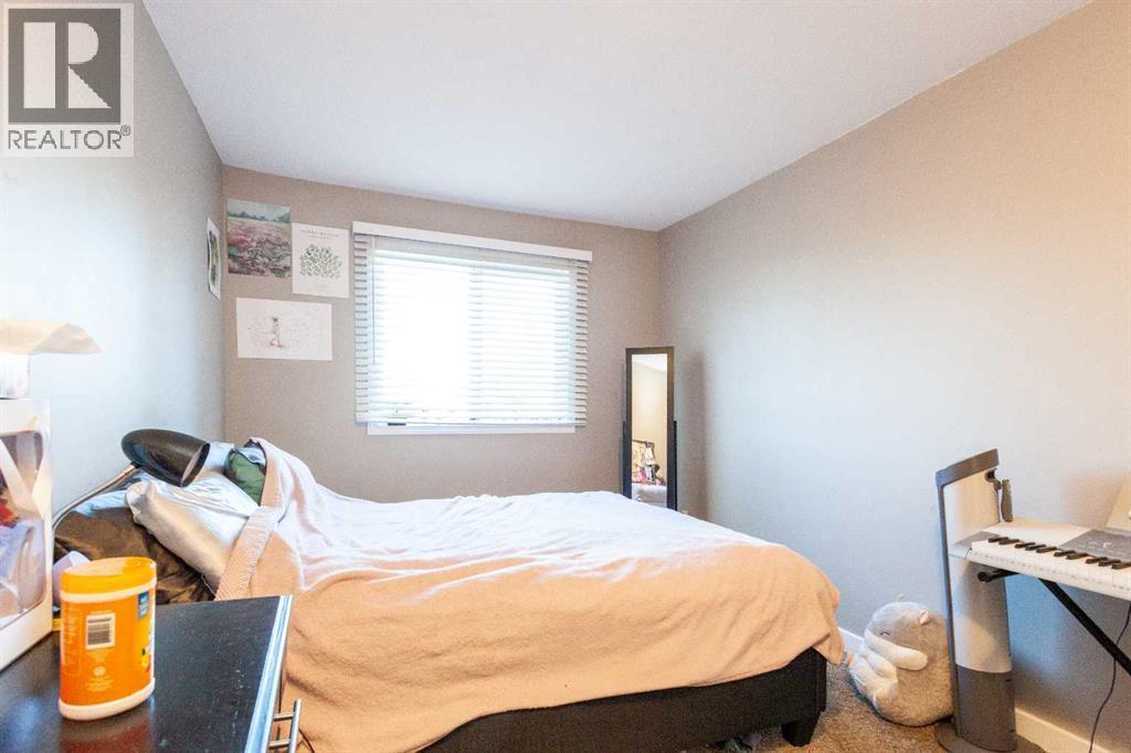 207B, 295 Columbia Boulevard W, Lethbridge, AB - Indoor Photo Showing Bedroom
