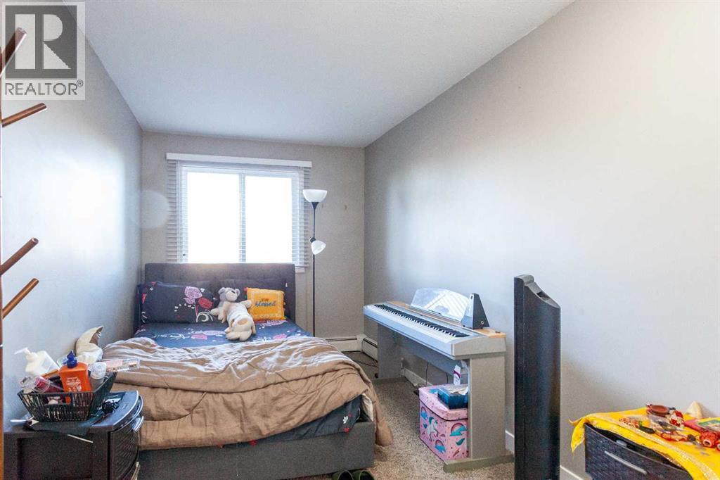 207B, 295 Columbia Boulevard W, Lethbridge, AB - Indoor Photo Showing Bedroom