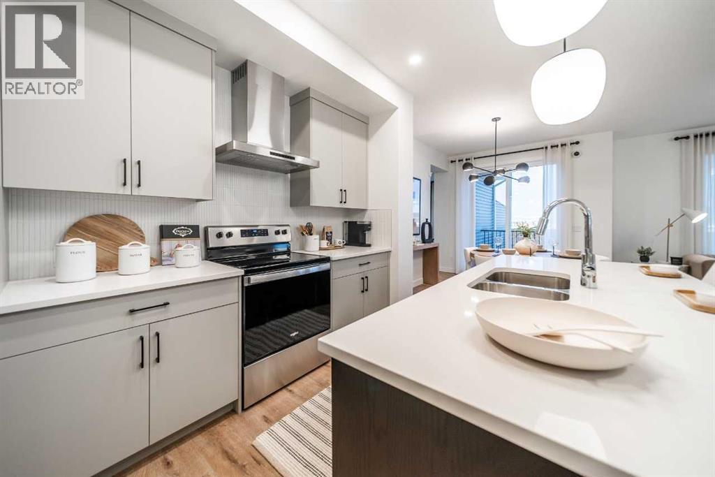 132 Southbow Village Way, Cochrane, AB - Indoor Photo Showing Kitchen With Double Sink With Upgraded Kitchen