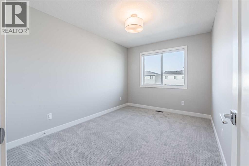 129 Dawson Wharf View, Chestermere, AB - Indoor Photo Showing Other Room
