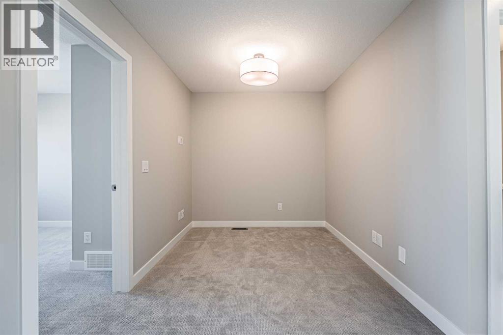 129 Dawson Wharf View, Chestermere, AB - Indoor Photo Showing Other Room