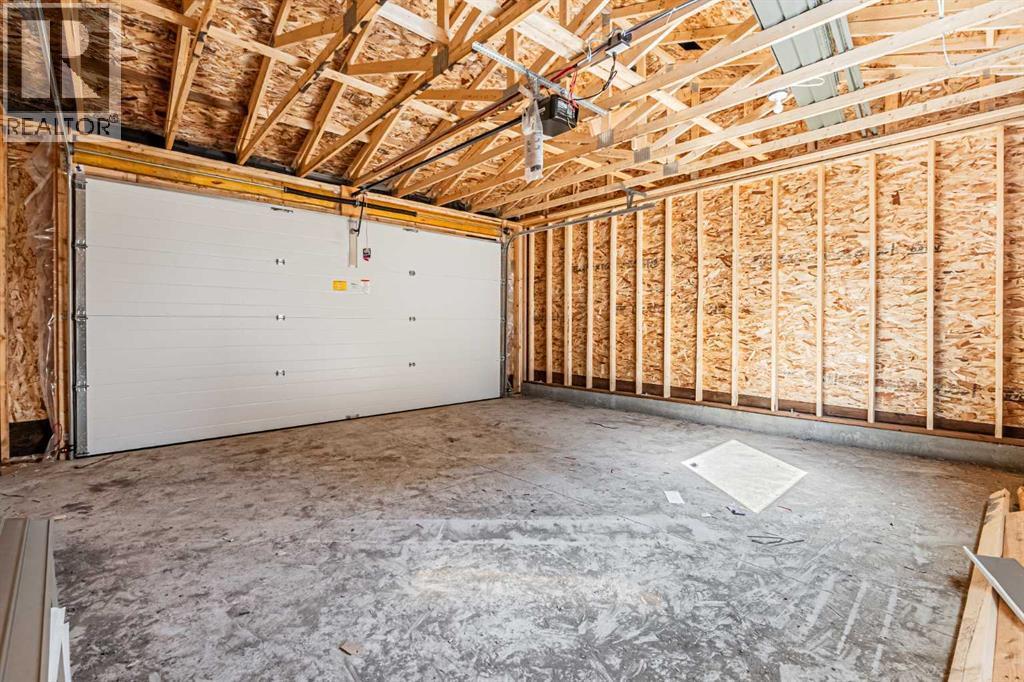 129 Dawson Wharf View, Chestermere, AB - Indoor Photo Showing Garage