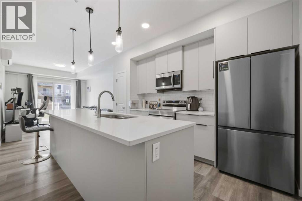 1104, 220 Seton Grove Se, Calgary, AB - Indoor Photo Showing Kitchen With Double Sink With Upgraded Kitchen