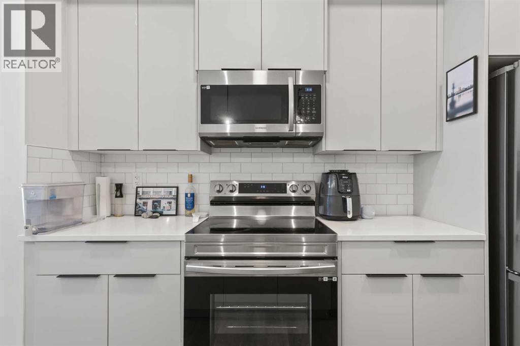 1104, 220 Seton Grove Se, Calgary, AB - Indoor Photo Showing Kitchen With Upgraded Kitchen