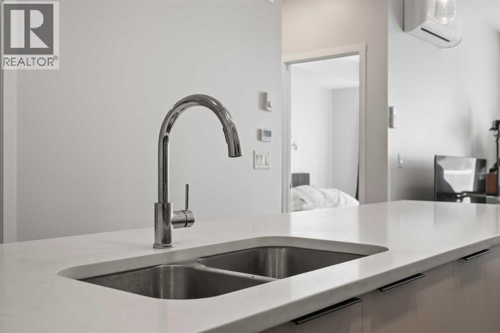 1104, 220 Seton Grove Se, Calgary, AB - Indoor Photo Showing Kitchen With Double Sink