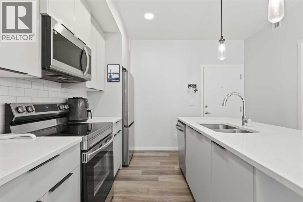 1104, 220 Seton Grove Se, Calgary, AB - Indoor Photo Showing Kitchen With Double Sink