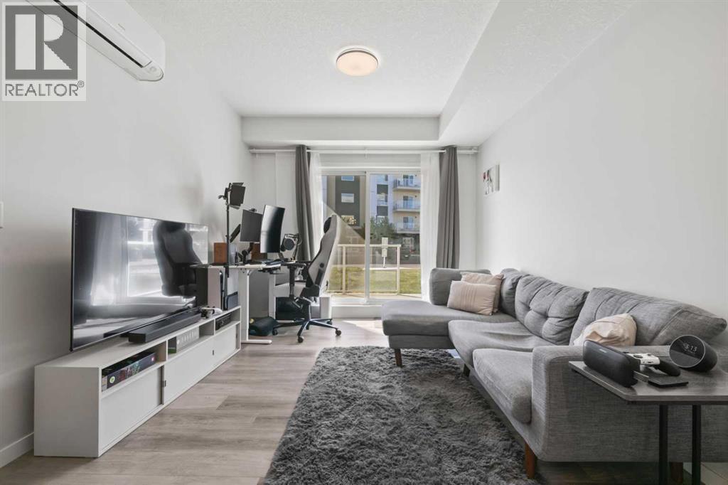 1104, 220 Seton Grove Se, Calgary, AB - Indoor Photo Showing Living Room