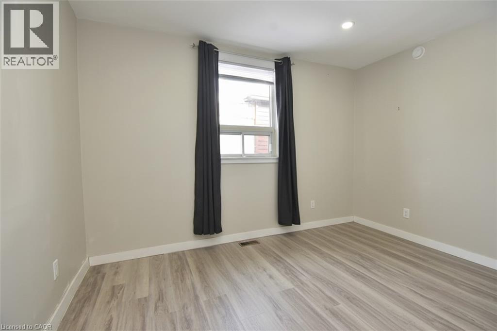 Unfurnished room featuring light wood-style floors and recessed lighting - 371 Fairfield Avenue, Hamilton, ON - Indoor Photo Showing Other Room