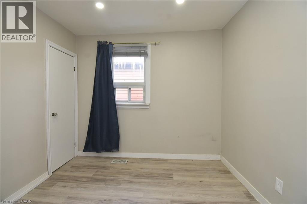 Unfurnished room with light wood-style flooring and recessed lighting - 371 Fairfield Avenue, Hamilton, ON - Indoor Photo Showing Other Room