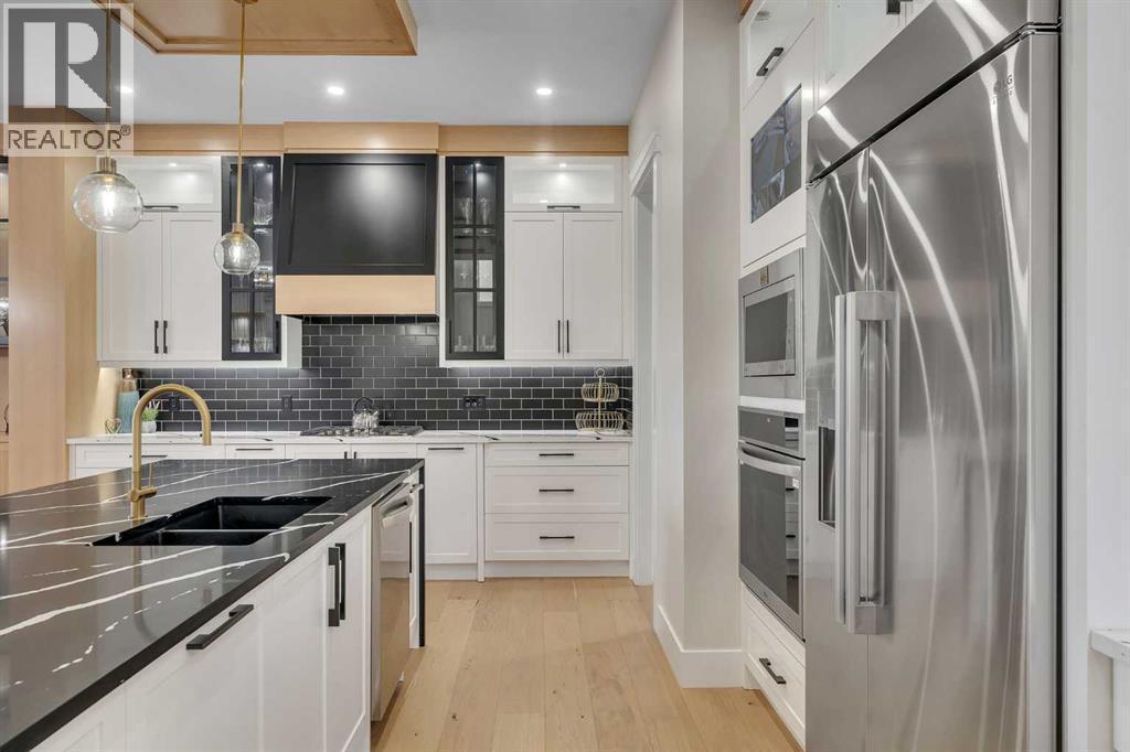 2012 Waterbury Road, Chestermere, AB - Indoor Photo Showing Kitchen With Double Sink With Upgraded Kitchen