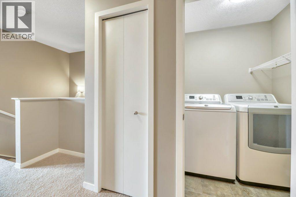 15 Copperpond Close Se, Calgary, AB - Indoor Photo Showing Laundry Room