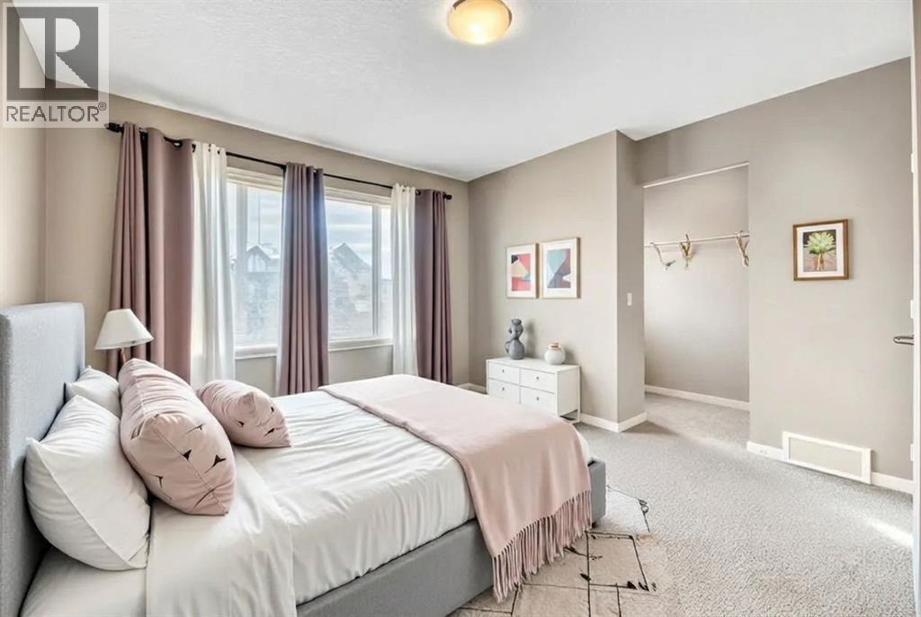 15 Copperpond Close Se, Calgary, AB - Indoor Photo Showing Bedroom