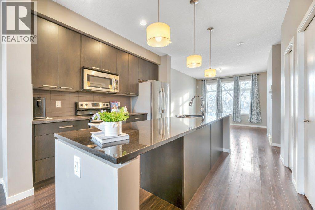15 Copperpond Close Se, Calgary, AB - Indoor Photo Showing Kitchen With Stainless Steel Kitchen With Upgraded Kitchen