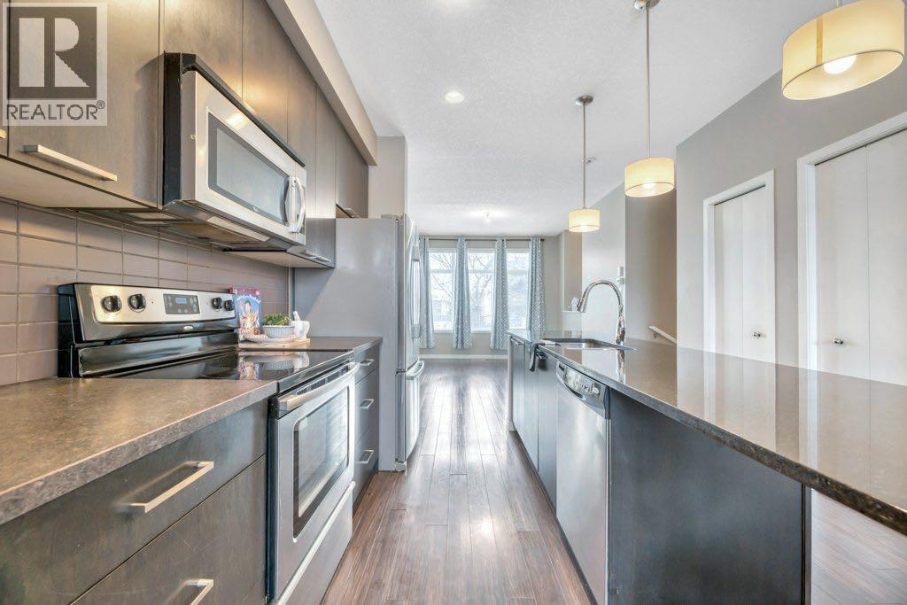 15 Copperpond Close Se, Calgary, AB - Indoor Photo Showing Kitchen With Stainless Steel Kitchen With Upgraded Kitchen