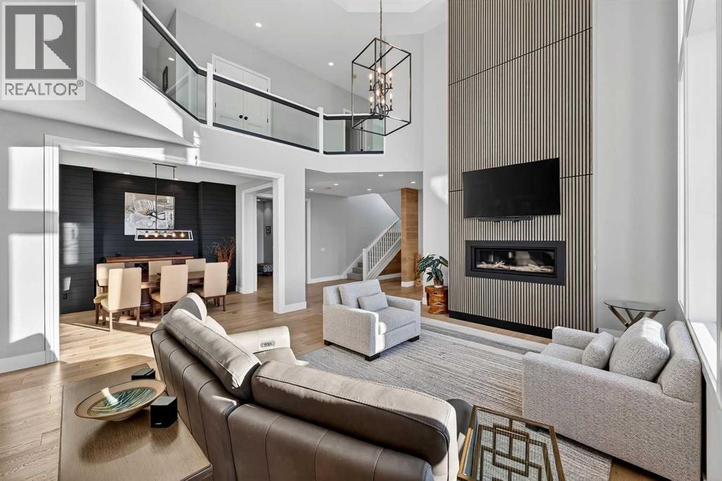 402017 23 Street W, Rural Foothills County, AB - Indoor Photo Showing Living Room With Fireplace