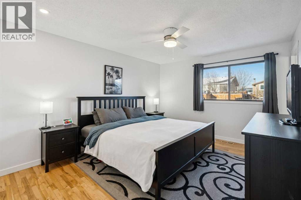 Primary bedroom - 14 Glenhill Crescent, Cochrane, AB - Indoor Photo Showing Bedroom