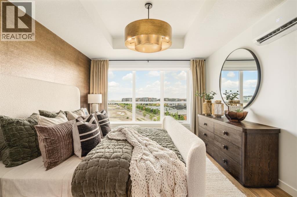 205, 10 Cascade Ridge, Canmore, AB - Indoor Photo Showing Bedroom