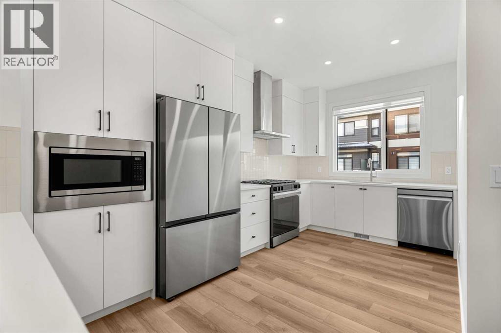 203, 550 Seton Circle Se, Calgary, AB - Indoor Photo Showing Kitchen With Upgraded Kitchen