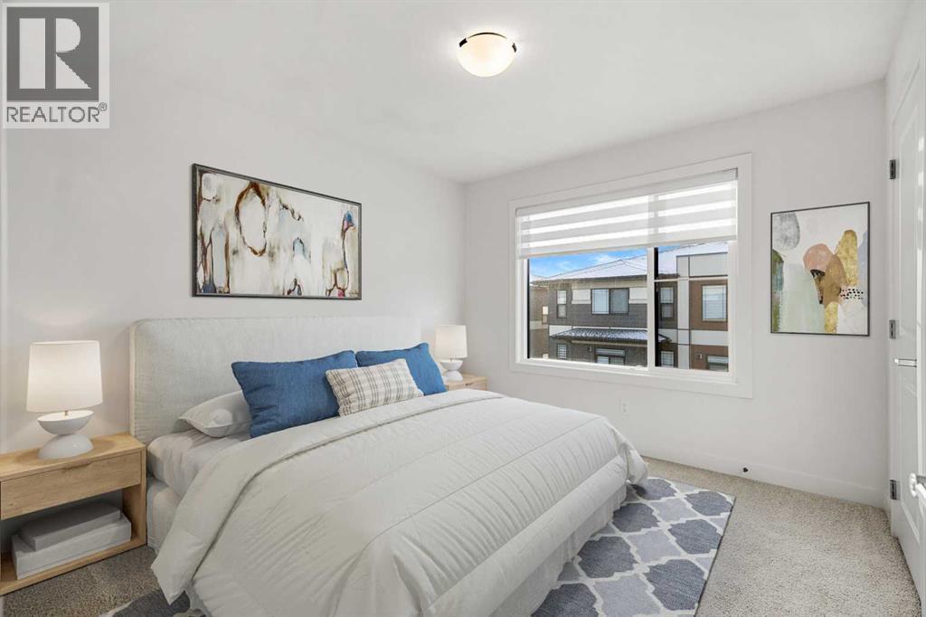 203, 550 Seton Circle Se, Calgary, AB - Indoor Photo Showing Bedroom