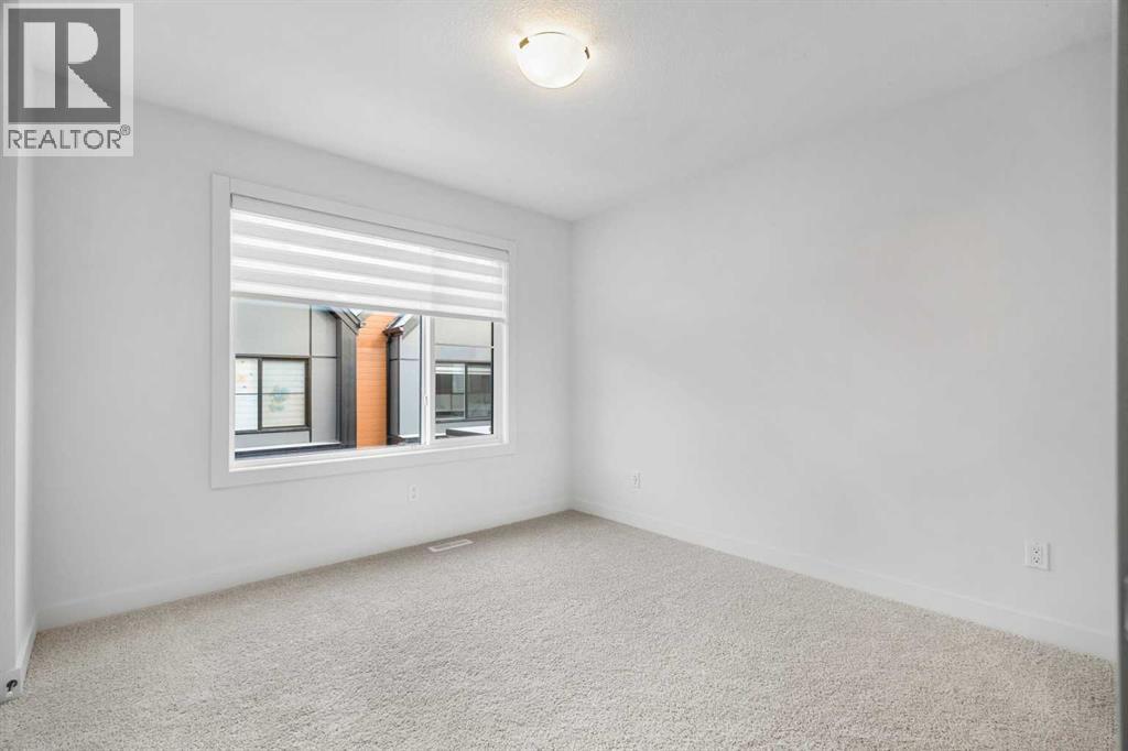 203, 550 Seton Circle Se, Calgary, AB - Indoor Photo Showing Other Room